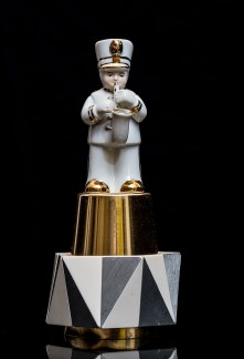 Mimi Berlin, 2013. History of Circus Legends. Saxophone Player. (1990s ceramic, 1960s anodized aluminum signed Markill, 1980s plastic/metal) 9 x 19 cm,